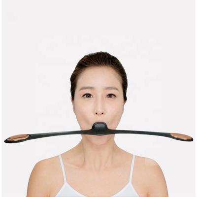 China Beauty Masseter Training Products Easy Face Slimming Massager To Remove Nasolabial Fold V Face Lift Tools And Equipment for sale