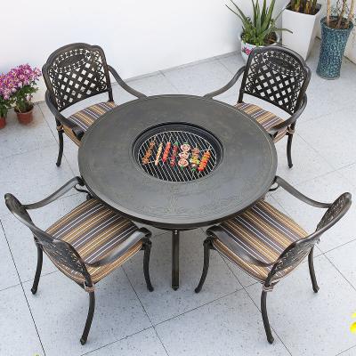 China Outdoor Garden Courtyard Round Dining Cast Aluminum Patio Table And Chairs Set for sale