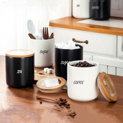 China New Nordic Microwavable Kitchen Storage Cans Tea Coffee Bean Storage Cans Wholesale Ceramic Sealed Cans With Wooden Lids for sale