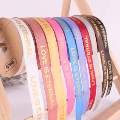 China Simple Recyled 2.5cm spiricle ribbon face with logo LOVE IS ETERNAL for sale