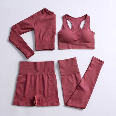 China Gym Breathable Solid Color Sports Breathable Fitness Seamless Yoga Suit Knitted 4 Piece Women Set ER21188 for sale