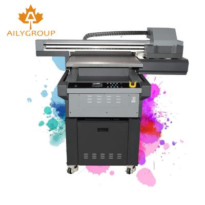 China Garment shops plastic uv printer xp600 uv plotter plastic card id label label printer uv digital printer for sale