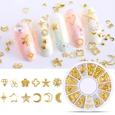 China FREE SHIPPING Tiny Hollow Nail Art Gold Metal Tips Decoration Japan 3d Nail Art Wheel Case Star Moon Nail Ornament for sale