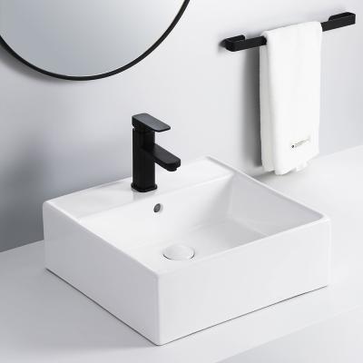 China Bathroom Wash Small Size Ceramic Hand Basin New Art Basin Sink Easy Clean Design for sale