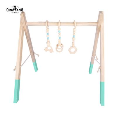 China QINGTANG Collapsible Foldable Wooden Rack Baby Hanging Bar Wooden Baby Gym for sale