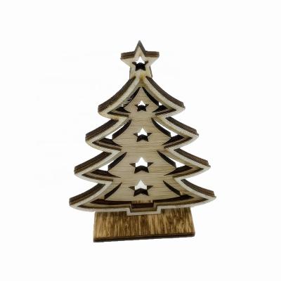 China Handmade Hollowed-out Christmas Tree Shaped Wooden Ornaments for sale