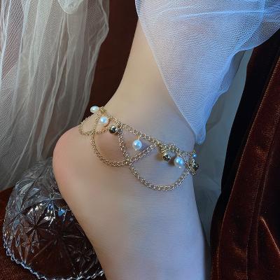 China Forest palace anklet chain children anklet female bell foot fashionable antique sexy red net natural pearl CLASSIC 2021 new for sale