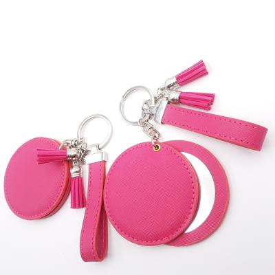 China Retro Souvenir Gifts Promotion Beauty Enlargement With Leather Handheld Portable Cosmetic Mirror Key Chain With Tassels for sale