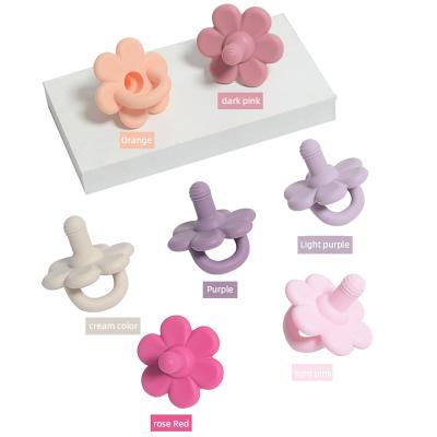 China Soft Toy Mother and Baby Products Flower Shaped Silicone Pacifier Tooth Glue Baby Biting Music Chewing Toy Baby Pacifier for sale