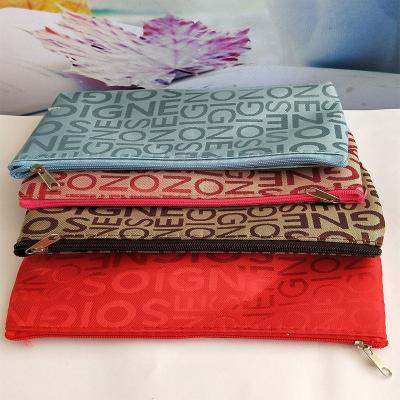 China Wholesale Fashion Leisure Style Jacquard Letter Bag Horizontal Square Hand Makeup Bag for sale