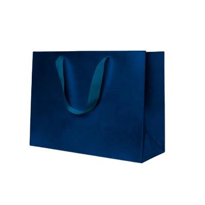 China Recyclable Custom Royal Blue Dress Garment Paper Bag Luxury Clothing Tote Bags Printed Gift Bags for sale