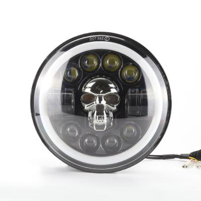 China PC+Aluminum 7 Inch Harley Skull LED Headlight DRL Hi/Lo Beam H4 180W Halo Motorcycle IP68 12V For Jeep Niva Ring Amber Angel Eye for sale