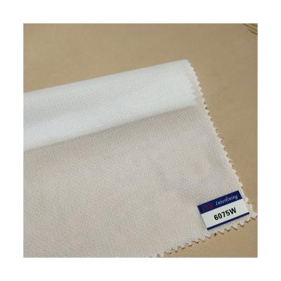 China Factory Direct Selling Woven Interlining 6075 Fusible For Quilts Wholesale Fusible Polyester Woven Stitchbond Fabric Interlinings And Liners for sale