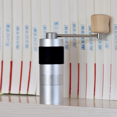 China Mini PORTABLE Manual Portable Coffee Grinder Coffee Grinder Household Coffee Tools Titanium Plating Stainless Steel Burrs for sale