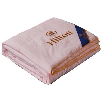 China Wholesale Home Bedding Manufacturers 2 Color Bodywarmer Blankets Hilton Quilt Blanket Comforter Bedspread With Bag for sale