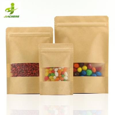 China Biodegradable In Stock 12*20cm Compostable Printed Window Stand Up Brown Self Seal Zip Lock Kraft Paper Bag For Food Nuts Packaging Pouch for sale