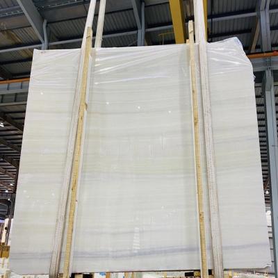 China Factory Wholesale Modern Polished Athens White Onyx Slabs With Wood Veins White Marble Slab Wall Stone for sale