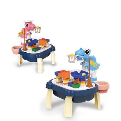 China Educational Toys Plastic Plastic Kids Playing Blocks Track Dinosaur Projection Shooting Building Block Painting Table For Children for sale