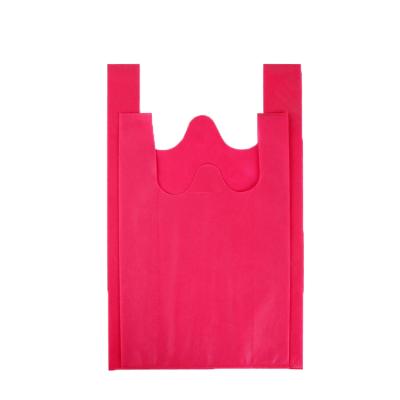 China Best Selling PUNCH T Shirt Bags China Supplier T Shirt Yarn Bags Embossed Non Woven Spunbond T Shirt Shopping Bag For Supermarket for sale