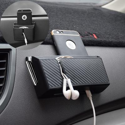 China Removable sticky imitation sticky storage box carbon fiber sports vehicle multi-function mobile phone storage box storage box for sale