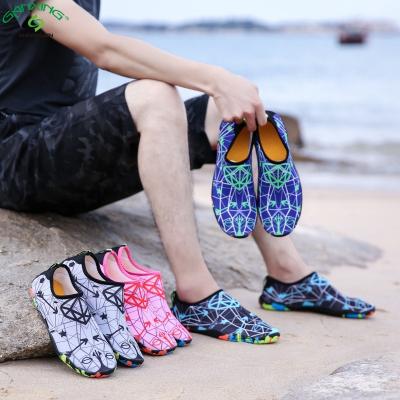 China Lightweight GANXING Customized Skin Barefoot Anti-Slip Aqua Sneakers Non Slick Beach Shocks Water Shoes For Women Kids for sale