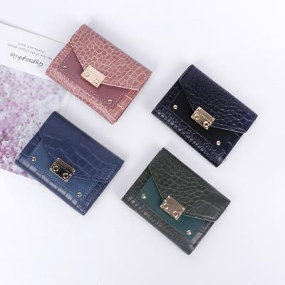 China Vintage PU Coin Luxury Vintage Leather Kid RFID Women's Wallets Buckle Short Credit Card Holder Clips Female Men Unisex for sale