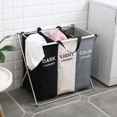 China 3 Compartment X-shaped Printing Foldable Waterproof Dirty Laundry Hamper Sustainable Clothes Sorting Hamper for sale