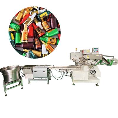 China Food Candy Packing Machine Wine Bottle Form Chocolate Foil Packing Machine for sale