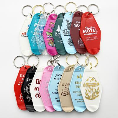 China Rosebud Dragonfly Inn Logo Plastic Custom Classic White Round Retro Vintage Motel Hotel Room Plastic Key Flag for sale