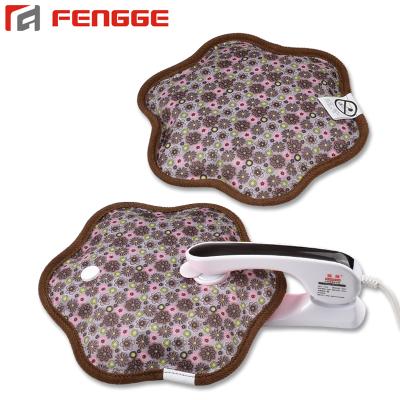 China Printed Fabric Round Shape Electric Heated Hand Warmer Rechargeable Hot Water Pack for sale