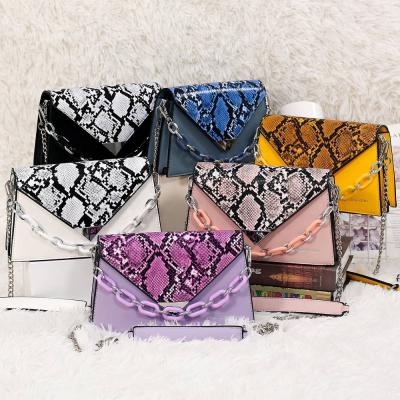 China Newest High Quality Popular Statistical Institute Snakeskin Clamshell Bags Shoulder Cross - Body Chain Clips Women And Handbags Luxury Handbags for sale