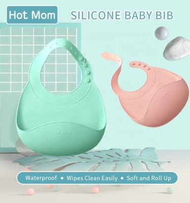 China Silicone Hot Mom Baby Silicone Waterproof Bib Easily Wipes Clean Soft Baby Bibs With Adjustable Strap BPA Free for sale