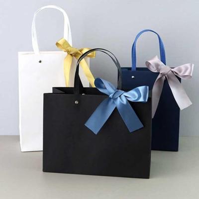 China Recycled Materials Wholesale Custom Black Luxury Shopping Paper Gift Bag With Handle for sale