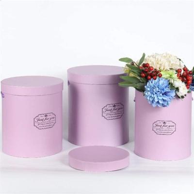 China Recycled Materials Pravite Label Fresh Flowers Pink Cardboard Round Gift Flowers Packaging Newspaper Distribution Tour Box for sale