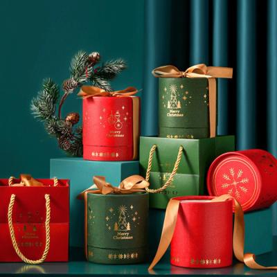 China Recycled Materials Red Green Christmas Gift Giving Present Candy Round Packaging Paper Box With Bag for sale