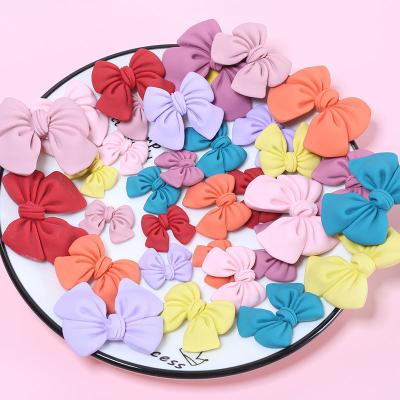 China Worldwide DIY Resin Bow Tie Charms Flatback Bowknot Cabochon Kawaii Resin Craft Jewelry Making Ornament Phone Decoration for sale