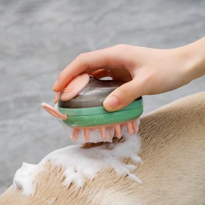 China Viable 2 in 1 Pet Grooming Cleaning and Bathing Convenient Massage Comb Shampoo Dispenser Pet Bath Brush for sale