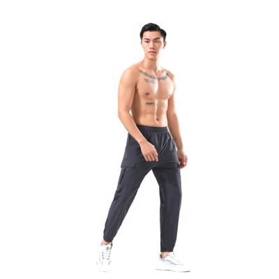 China Anti-Wrinkle Anti-Wrinkle Men Fashion Loose Pants Winter Quick-drying Sports Utility Pants With Pocket For Fitness for sale