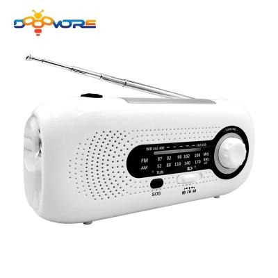 China Headphone jack; solar panel ; Low speaker; power bank; Flashlight ; 2022 Popular Dooomore Amazon Emergency AM Solar Powered FM Radio Light Power Bank Operate Rechargeable Portable Mini Hand Crank Radio for sale