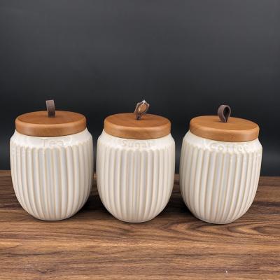 China Stocked 2021 Products Spice Jar Storage Coffee Sugar Tea Storage Ceramic Jar Bamboo Lids for sale