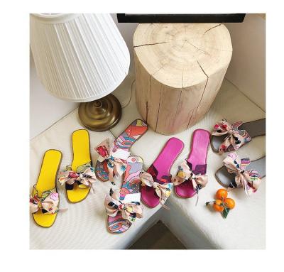 China 2021 new fashion trend women's summer all-match bow slippers women's flat-bottomed beach seasonal shoes for sale