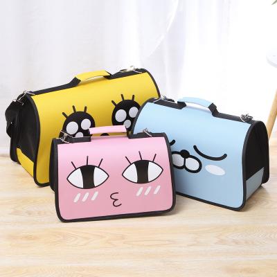 China 2021 Cute Cat Bag Pet Handbag Eye Travel Stocked Bag Portable Cartoon Cat Carrier Supplies Printed Pet for sale