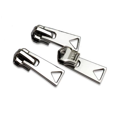 China The durable 5# shinny slider automatic zipper puller the silver zipper slider for sale