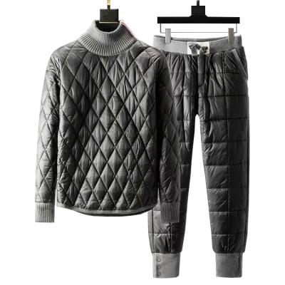 China Breathable Winter Men's Fashion Two-piece Set High-neck Down Cotton Pants Thickened Sweater Pullover Padded Pants Track Suit for sale