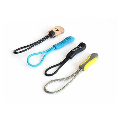 China Other Design Embossed Name Custom Fancy Logo PVC Rubber Zipper Pulls For Handbag Black Bagrubber Pull Zipper Puller for sale