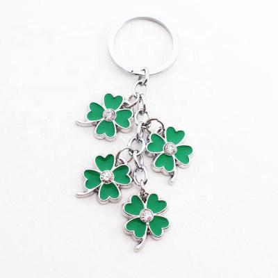 China Creative Four Metal Lucky Clover Couple Key Ring Car Key Chain Dangle Pendant Key Chain For Bag for sale