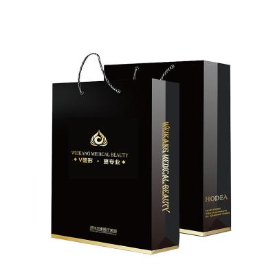 China Recycled Materials Custom printing black luxury shopping gift paper bag kraft paper bag with logo printing for sale