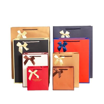 China Recycled Materials White card kraft paper upscale wine paper bag shopping gift bag wholesale for sale