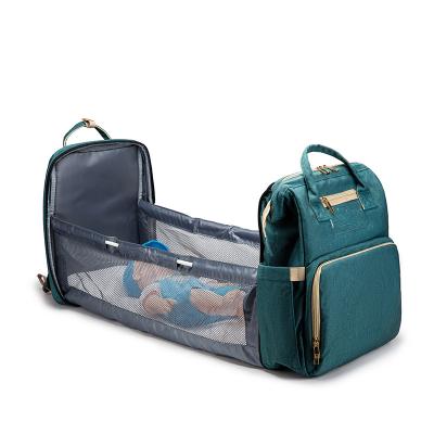 China Amazon Eco-Friendly Folding USB Crib Mom Bag Multifunctional Tarvel Baby Care Backpack Waterproof Shoulders Bag for sale