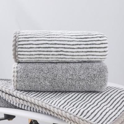 China Single Viable Charcoal Bamboo Fiber Coral Fleece Thickened Stripes Dry Hair Wash Absorbent Towel for sale